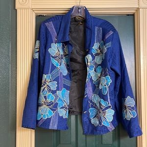 Alex Kim, blue textured jacket, aqua flowers with gold glitter trim.